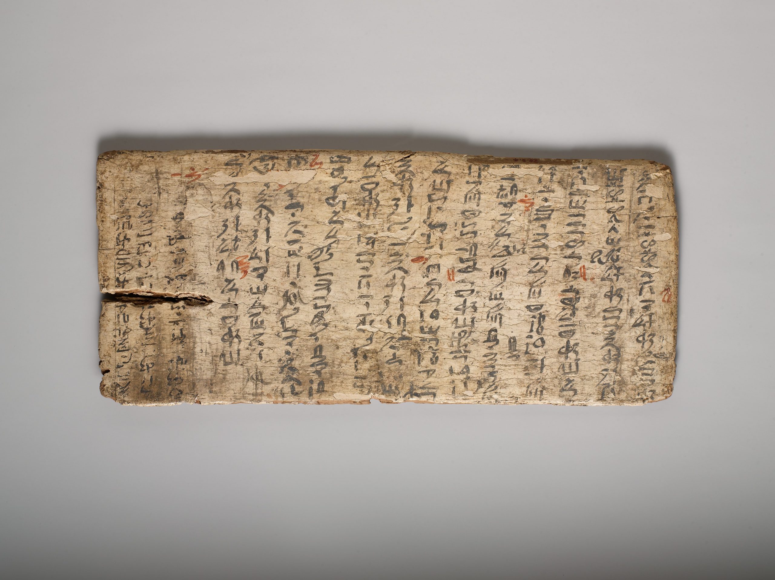 Ancient gessoed board with illegible characters